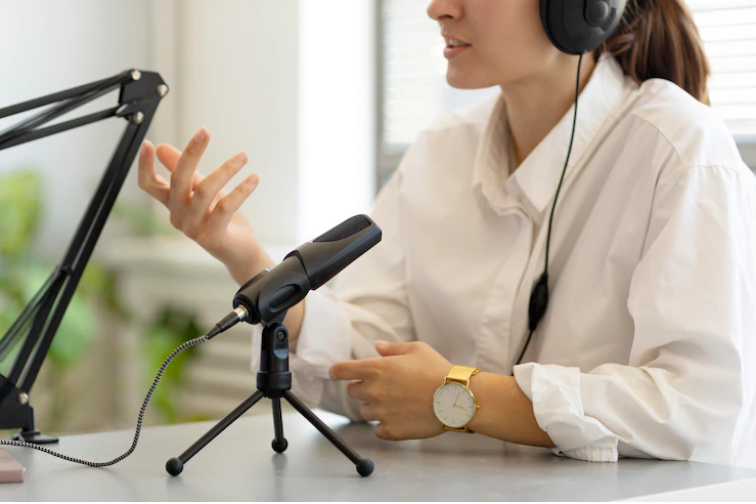 a woman recording b2b marketing podcasts at her studio