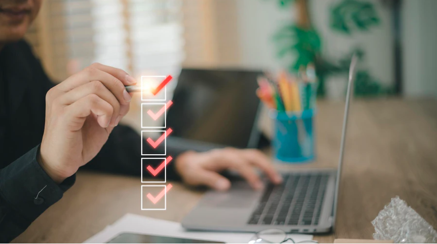 An event manager filling a conference planning checklist ahead of planning a conference